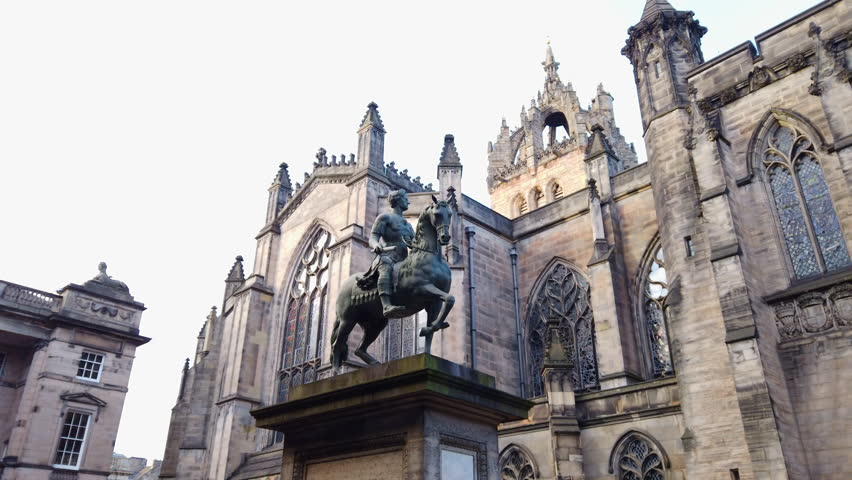 Pan down from Charles II (Equestrian Statue) in Parliament Square to the back of St Giles
