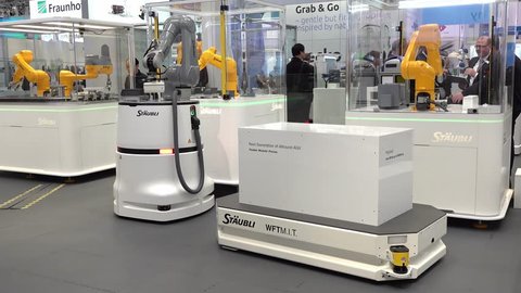 HANNOVER / GERMANY - APRIL 02 2019 : Staubli is presenting the newest generation of cobots - Collaborative robots - and HGVs at the HANNOVER FAIR.