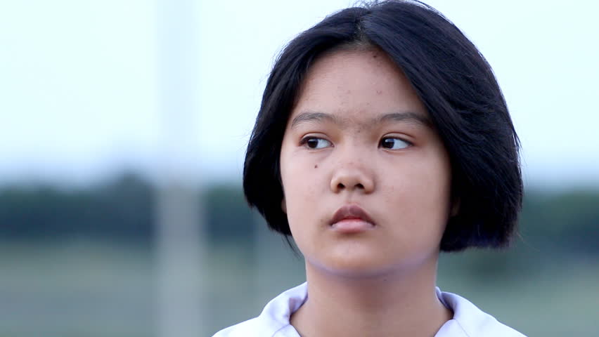 Portrait of Thailand student feel moody and standing outdoor 