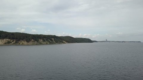 View to the beach and famous cliff in Gdynia, Poland. Footage taken from Gdansk Gulf (Baltic sea)