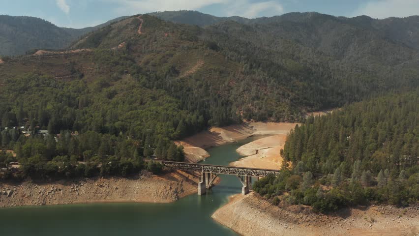Aerial view of bridge over Shasta Lake in Northern California low water levels during drought