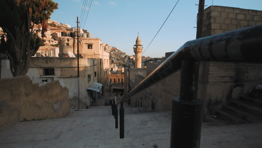 Old traditional Arabic houses and alley in Al Salt city, dolly left, Jordan.