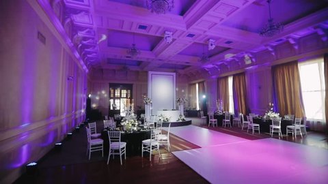 White table for newlyweds. Luxury banquet hall decorated in black and white tones