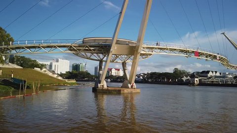 Kuching, Malaysia - April 2019. Cinematic shot of Darul Hana Bridge. This wonderful architechture is a landmark in Kuching waterfront
