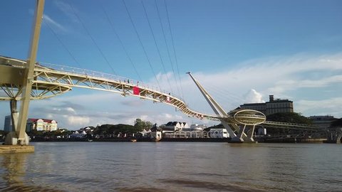 Kuching, Malaysia - April 2019. Cinematic shot of Darul Hana Bridge. This wonderful architechture is a landmark in Kuching waterfront