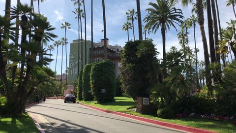 LOS ANGELES, March 30th, 2019: The entrance and driveway to the Beverly Hills Hotel, with the famous facade in the background. The iconic hotel is owned by the Sultan of Brunei.