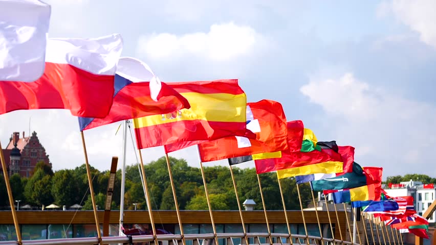 Flags of many nations waving together in a display of unity, slow motion. Royalty-Free Stock Footage #1026974972