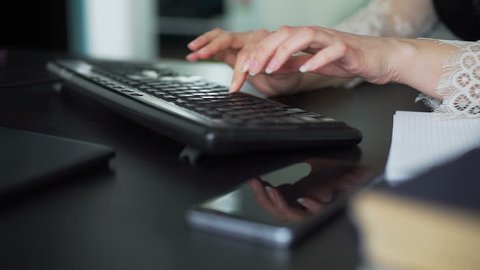 Female Hands Typing on a PC keyboard in an Office