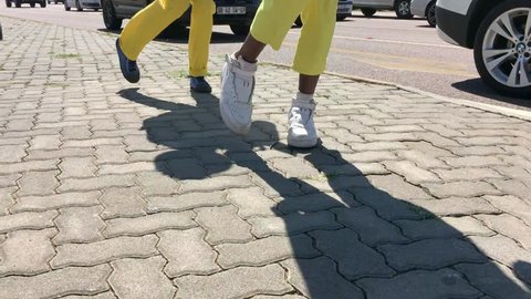 Johannesburg, South Africa, 29th March - 2019: Young men performing at traffic lights with fancy foot work dancing. A style of dancing from the townships
