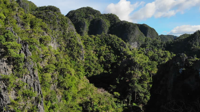 Ascending Aerial View of Rocky Island Jungle Landscape, 4K.