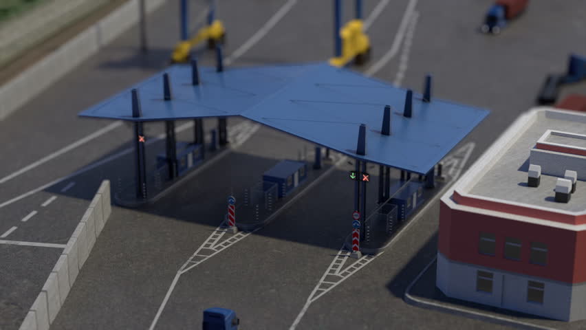 Lorry driving up to checkpoint. White road marking is being painted on asphalt. Three trucks driving up to parking lot and parking according to marking.