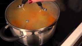Diced fresh butternut or pumpkin boiling in a pot