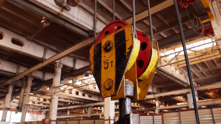 A big industrial lifting chain with a hook on the end