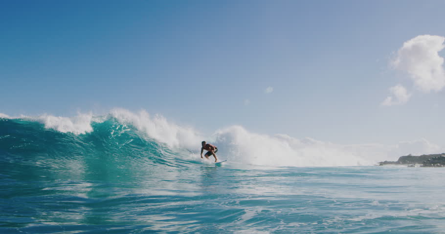Surfer riding and turning with spray on blue ocean wave, surfing ocean lifestyle, extreme sports, slow motion | Shutterstock HD Video #1027016201