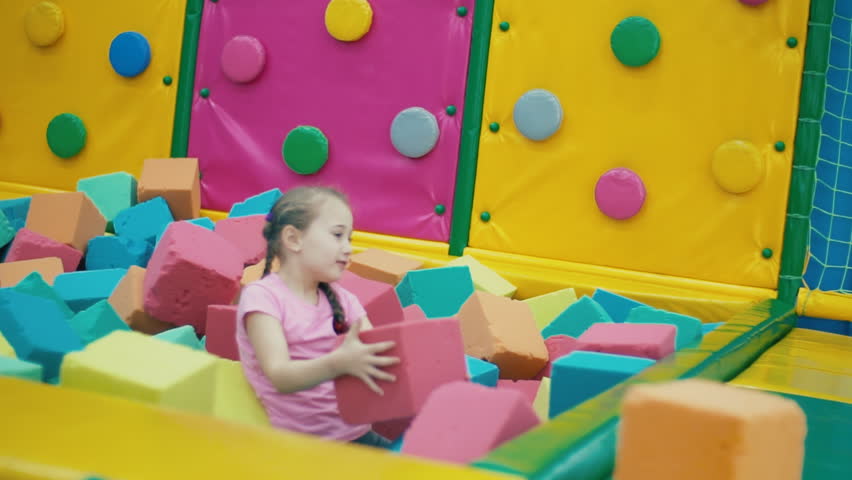 girl playing with soft cubes