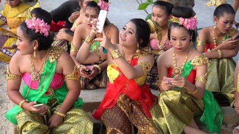 A group of Thai girls and ledyboy in national costumes, Suanthai. Pattaya, Thailand, 03.04.2019