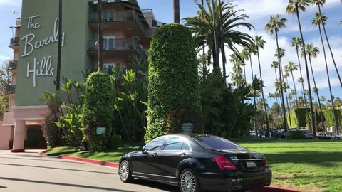 LOS ANGELES, March 30th, 2019: A black Mercedes stand in front of the famous Beverly Hills Hotel facade. The iconic hotel is owned by the Sultan of Brunei.