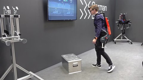 HANNOVER / GERMANY - APRIL 02 2019 : German Bionic presents first robot exoskeleton for the Industrial IoT at the HANNOVER FAIR.
