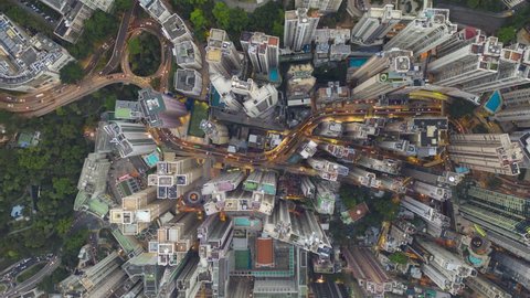 motion time lapse scene of huge building and road traffic transportation in day to night time at central area city in Hong Kong island urban area 4k video