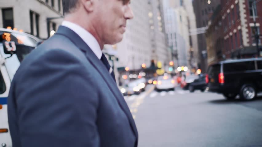 Senior businessman in New york street, wall street district. Daily life of a successful business man Royalty-Free Stock Footage #1027035314