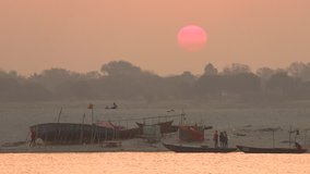 Sunrise over the Holy River Ganges in Varanasi in the Uttar Pradesh region of northern India, 4k footage video