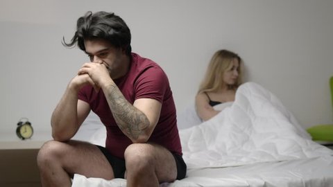 Couple having arguments and sexual problems in bed 