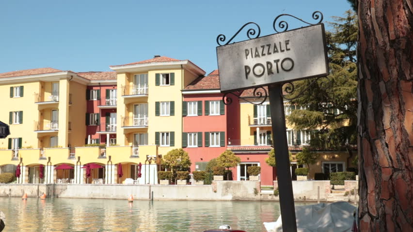Old mediterranean port square. Detail of ancient signboard in sirmione harbour ("piazzale porto" means "port square" in italian language)