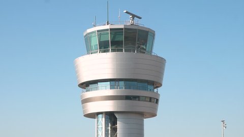 Air traffic control tower against the blue sky in the airport in Sofia, Bulgaria. 4k.