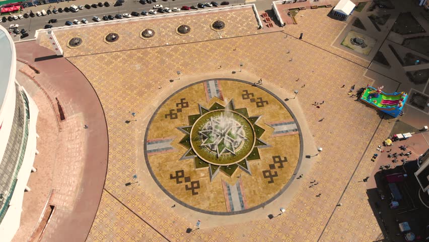 Aerial view of large fountain in the center of the city of Saransk, Russia. The shape of the fountain is made in the traditional geometric forms of ethnic mordvins. Taken by drone
