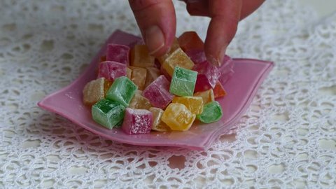 red, green, yellow and orange small Turkish delight,
close up of tiny turkish delight in plate
