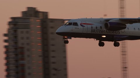 LONDON, circa 2019 - Close-up shot of a British Airways passenger plane landing at London City Airport during sunset