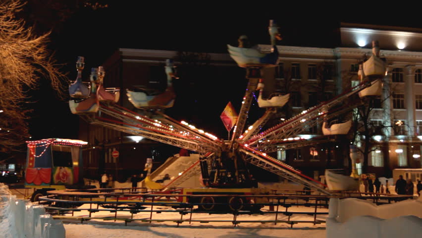 illuminated carousel in winter