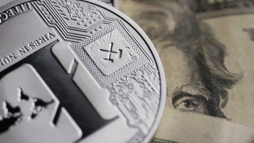 Rotating shot of Bitcoins digital cryptocurrency - BITCOIN LITECOIN