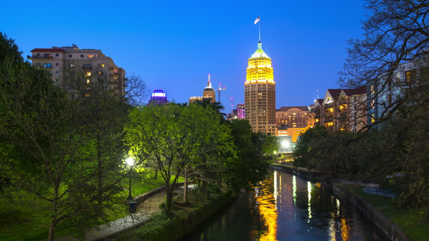 San Antonio TX Downtown River Walk Nature Scene Timelapse with Green Trees in a City Park Setting with a Generic Skyscrapers Landmark Architecture Background