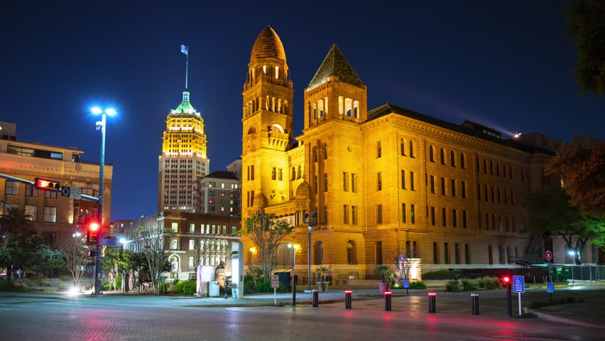 San Antonio TX Downtown Generic City Center Timelapse featuring the Bexar County Courthouse at Night with Streaking Lights from Vehicle Traffic Passing through the Street Intersection