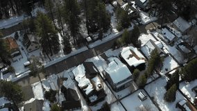 Houses covered in snow aerial drone video