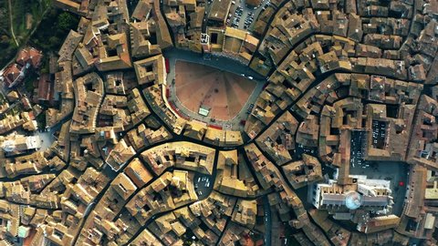 Aerial top-down view of Siena involving Piazza del Campo or Campo Square, a place of famous horse-race, Palio di Siena. Italy