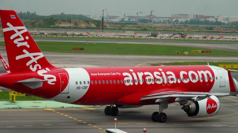 CHANGI, SINGAPORE - NOVEMBER 25, 2018 : AirAsia Airbus 320 HS-CBF taxiing before departure at Changi airport, Singapore.