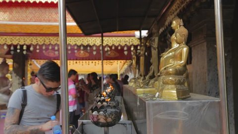 CHIANG MAI,THAILAND - CIRCA May 2015 :asian man preparing incense at Wat Phra That Doi Suthep