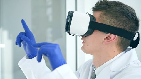 Doctor In Virtual Reality Glasses. Medical Technology Research Concept. Slow Motion Effect
