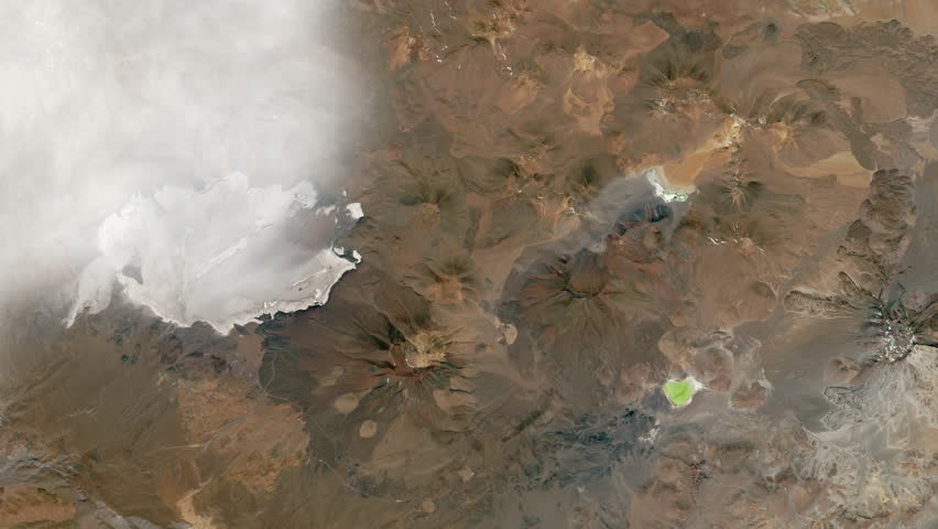 Llullaillaco volcano aerial satellite view with moving clouds. Contains public domain image by Nasa