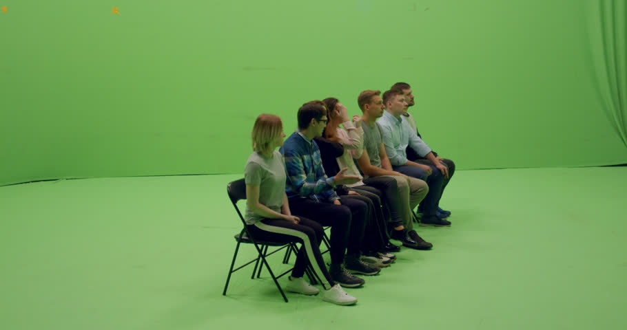 GREEN SCREEN CHROMA KEY Front view group of young people sitting and applause. 4K UHD ProRes 4444