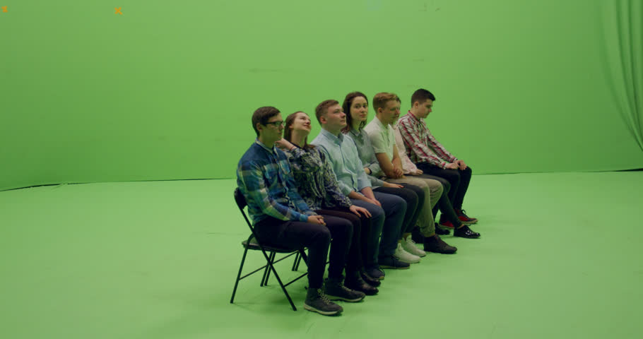 GREEN SCREEN CHROMA KEY Front view group of young people sitting and applause. 4K UHD ProRes 4444