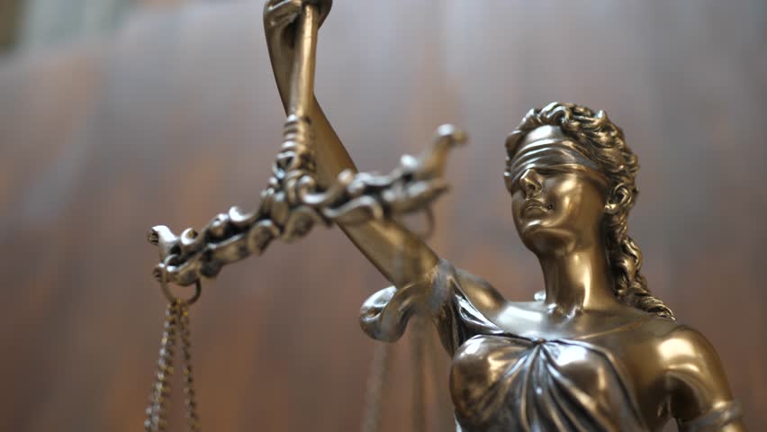 The Statue of Justice on Wooden Background. Concept of legal law, advice and justice Royalty-Free Stock Footage #1027133783