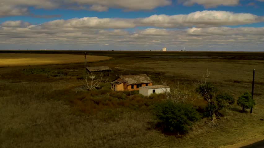 Timelapse footage with a drone circle around an abandoned farm in Texas.