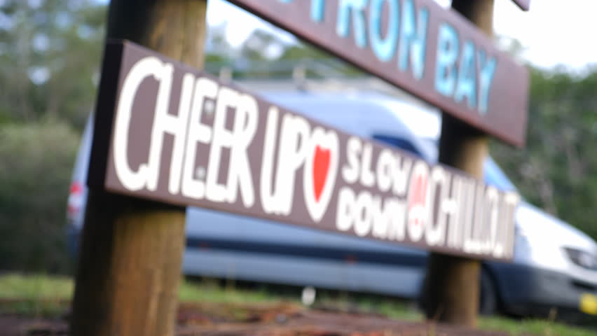 Tight shot of Welcome to Byron Bay sign, side on close up