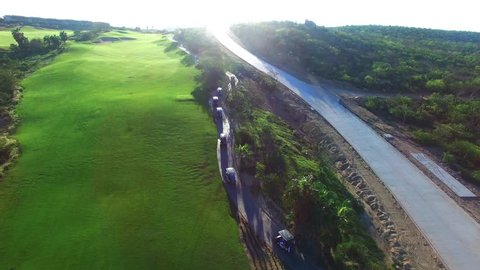 Drone flying over golf course following at sunset. Amazing sunset in los Cabos Mexico