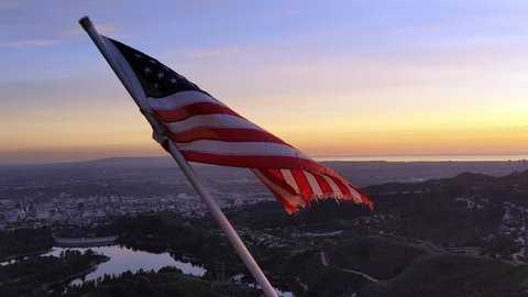 American Flag (USA) Flying In The Wind over the Hollywood Hills At Sunset Stockvideó