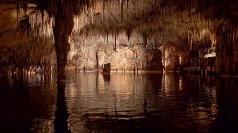Cuevas del Drach on Majorca Island, Spain. Stabilized shot of lake in dragon cave from boat