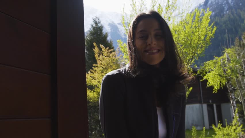 happy beautiful woman at a ski chalet chalet in Chamonix France 
